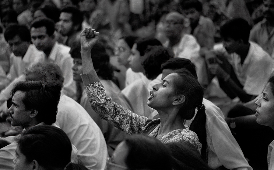 Azad attended political rallies with her sister when she was a child. As a singer and performer, she was involved with the women's movement, the committee demanding the trial of war criminals, and the cultural group Charon Shangshkritik Kenro, which led to her joining Shommilito Shangshkritik Jote. As part of this group, she was active in the movement to bring down President Ershad. Here, Azad is pictured protesting at a rally at Shahid Minar. Shahidul Alam (b. 1955, Dhaka, Bangladesh); Smriti Azad, Dhaka; 1994; photograph; courtesy of Drik.